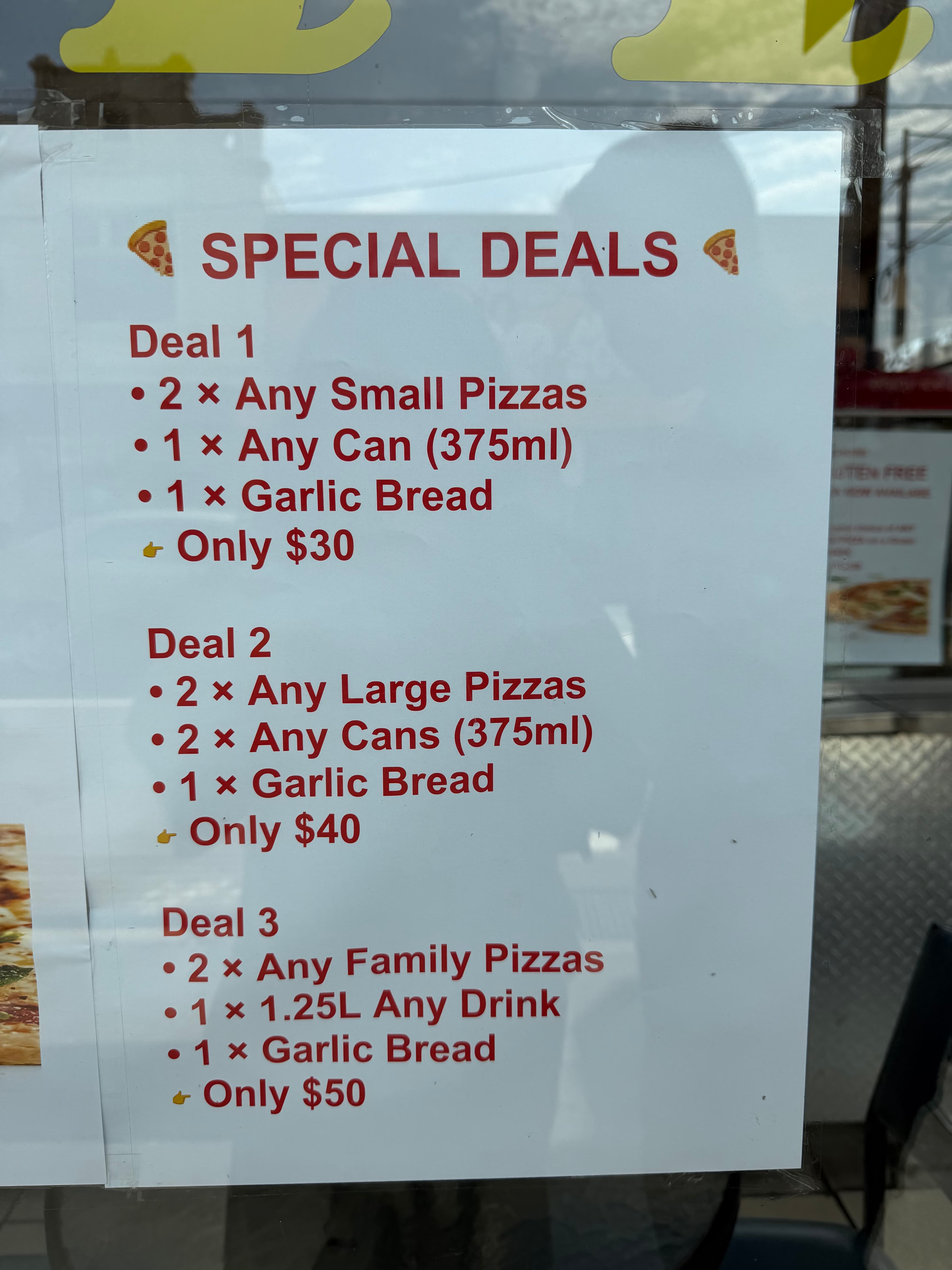 $40 for 2 large pizzas + 2 cans of drink + 1 garlic bread